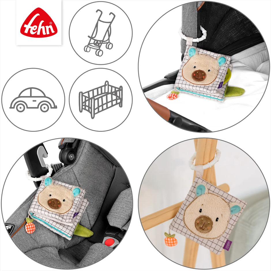 Stoffbuch Capybara für Babys mit Befestigungsring zur Nutzung am Kinderwagen, Bett oder Autositz als Spielzeug für unterwegs